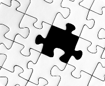 Missing puzzle piece on white jigsaw puzzle