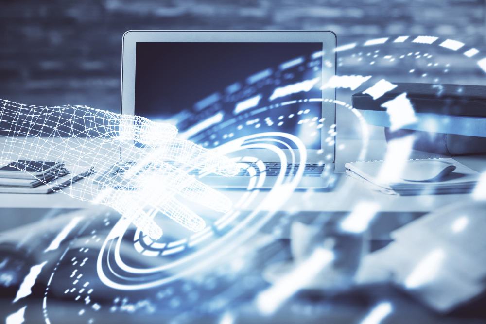 Wireframe hand reaching towards a laptop with holographic data visualization