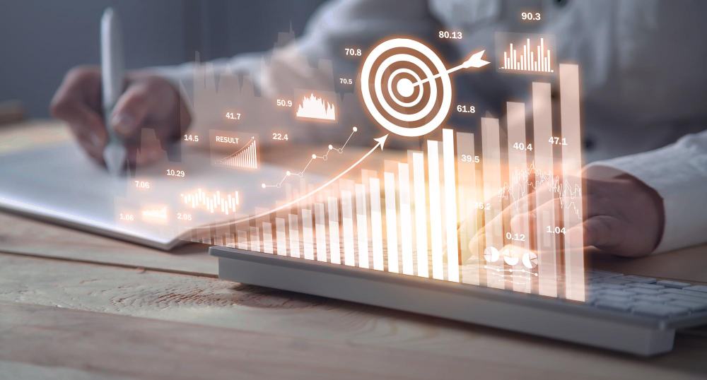 Hands on a laptop with a holographic ROI chart and target overlay