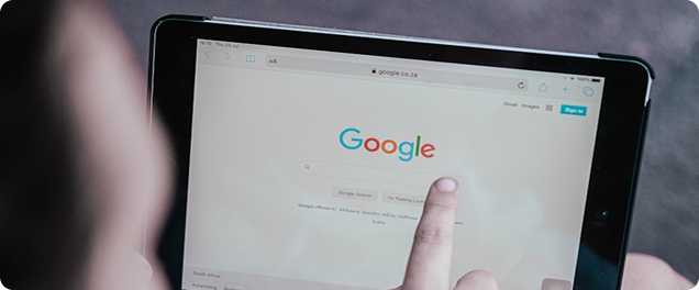 Person searching on Google with a tablet - off-page SEO